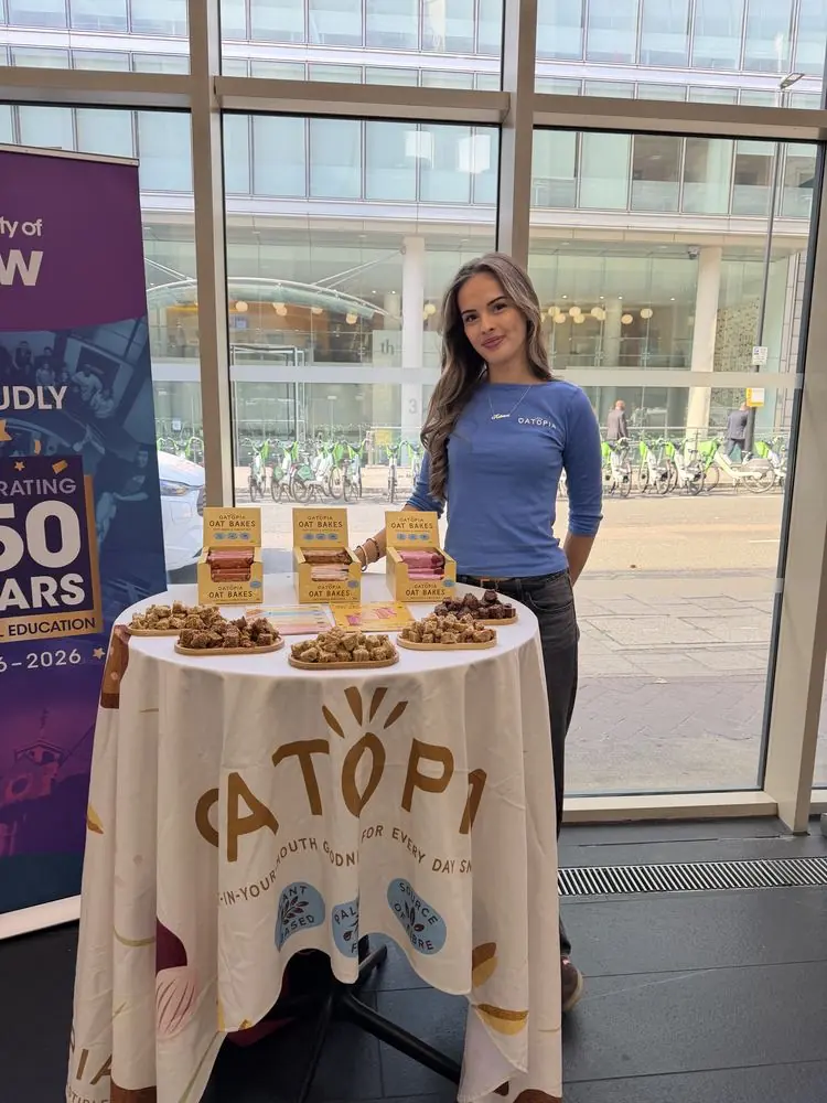 Sampling table of snack bars with a branded tablecloth